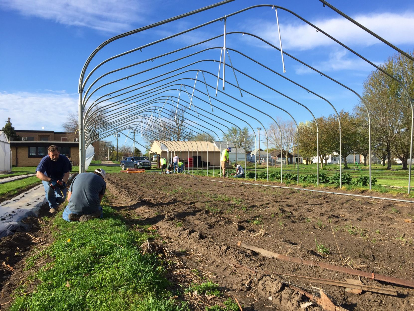 Old School Produce Partners re-erect hoop house